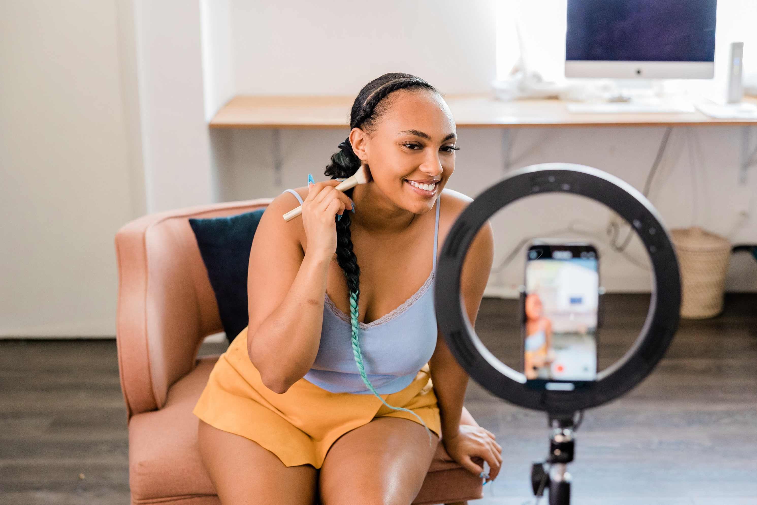 Woman Filming a Makeup Vlog at Home